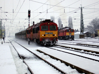 No. M41 2314 and M41 2120 diesel-electric locomotives with No. 525 fast train; and No. M62 140 diesel-electric locomotive at Szerencs station, Hungary, 26.12.2006.